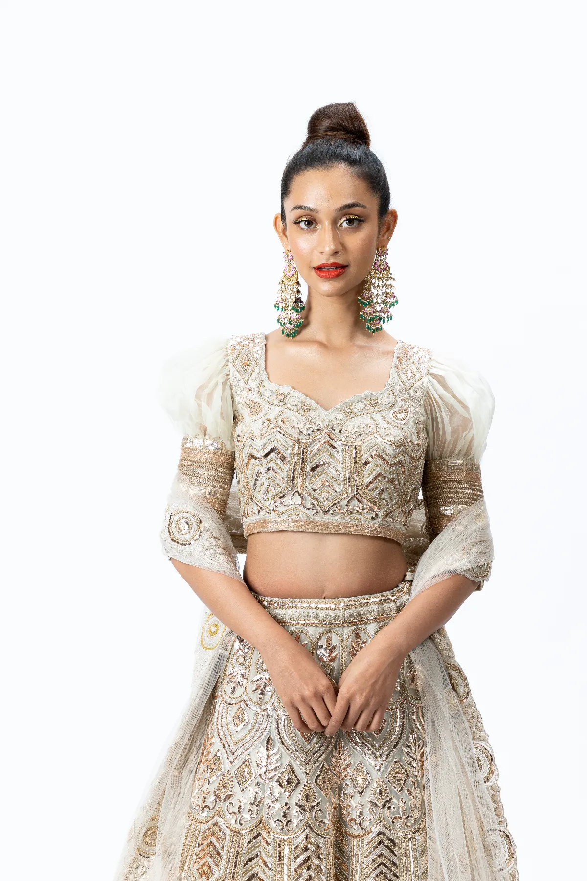 Beige Hand-embroidered Lehenga paired with Puff-sleeved Hand-embroidered Blouse and Hand-embroidered Dupatta with buttis